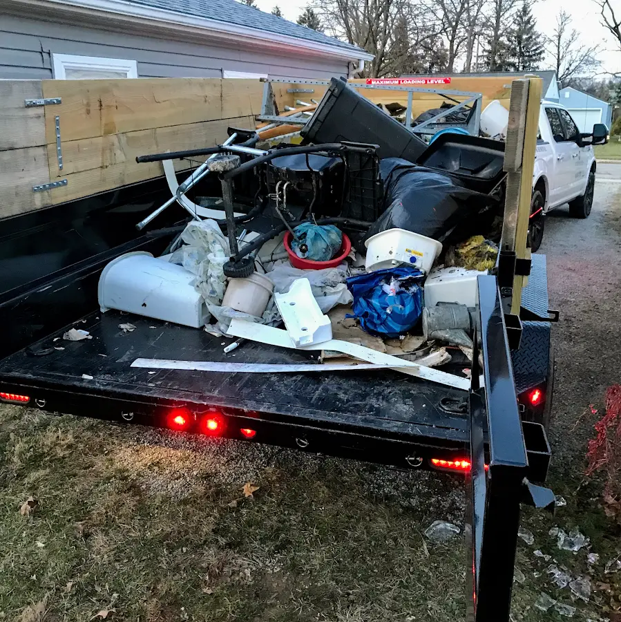 Roll-off dumpster delivered to a residential driveway in Altus